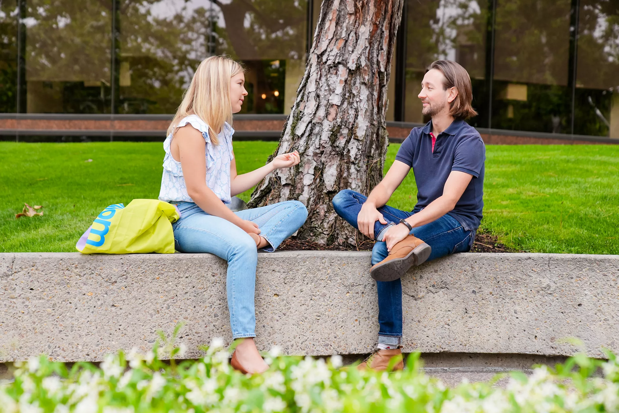 Kojiro Iizuka talking to a coworker