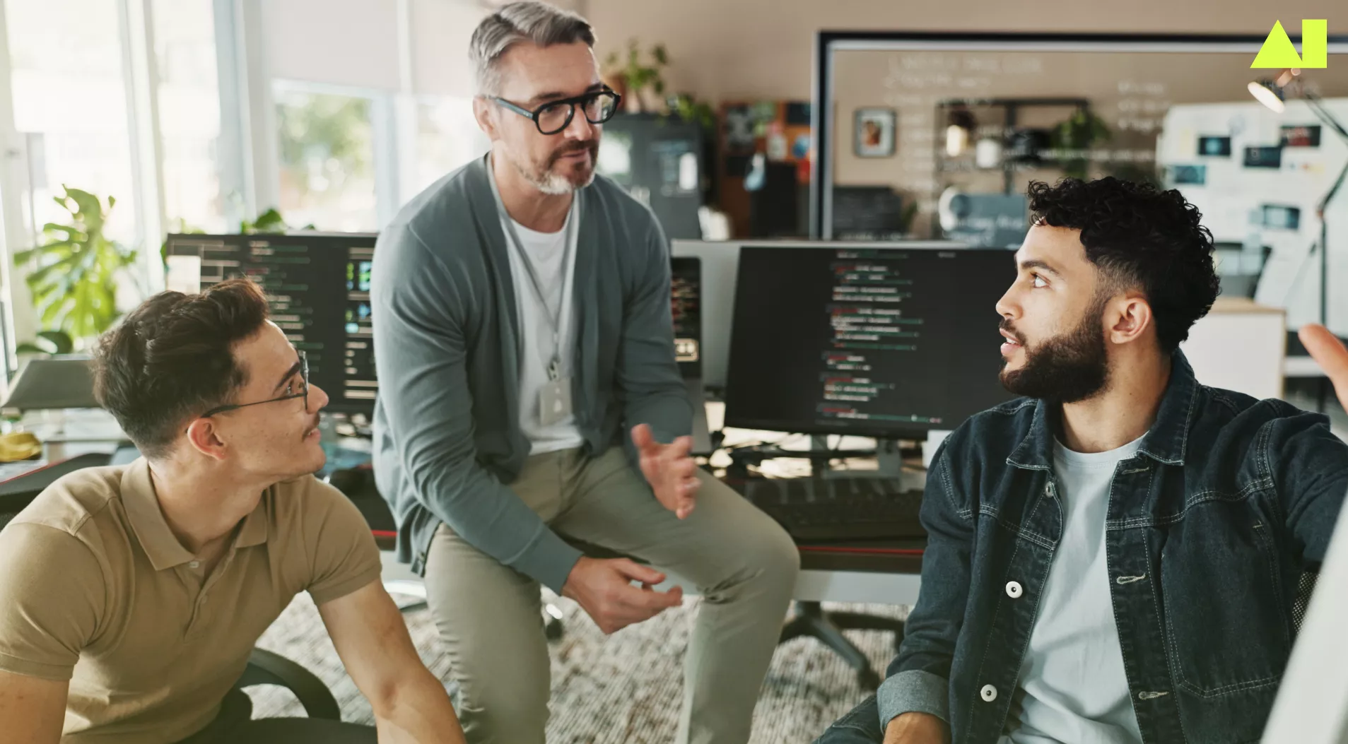 three men collaborating in an office