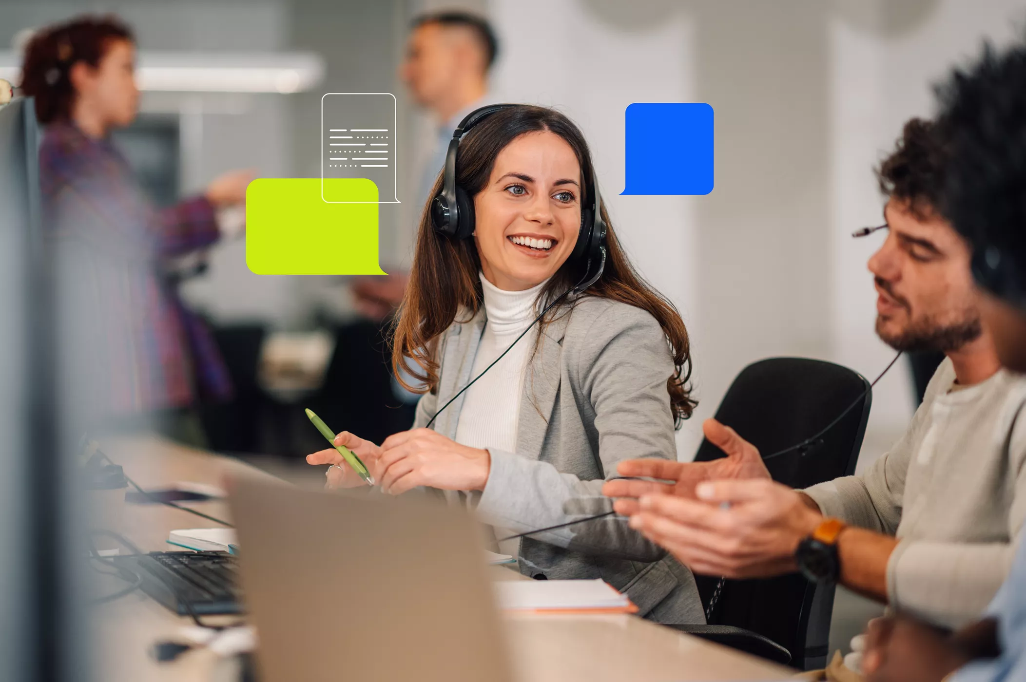 Smiling female customer service representative wearing a headset, talking with a colleague in a modern office, with colorful speech bubble graphics overlaid.