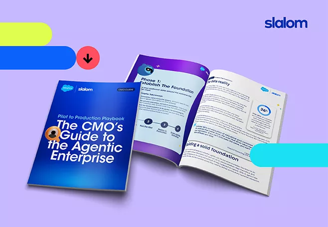 Digital artwork features a Slalom-branded guidebook titled "The CMO's Guide to the Agentic Enterprise" displayed against a purple background. One booklet is closed while another is open, revealing sections such as "Phase 1: Establish The Foundation" and "A solid reality" with charts and highlighted callouts. Colorful horizontal bars in blue, green, and yellow, along with a red downward arrow icon, add a modern, tech-oriented feel. The composition emphasizes marketing strategy, digital transformation, and professional thought leadership content.
