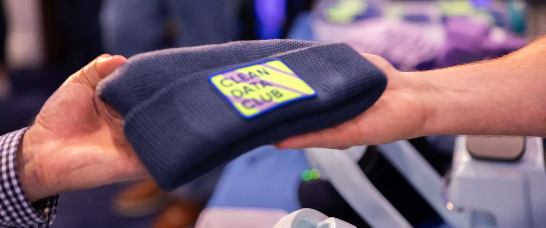 Navy hat with colorful patch with text that says Clean Data Club