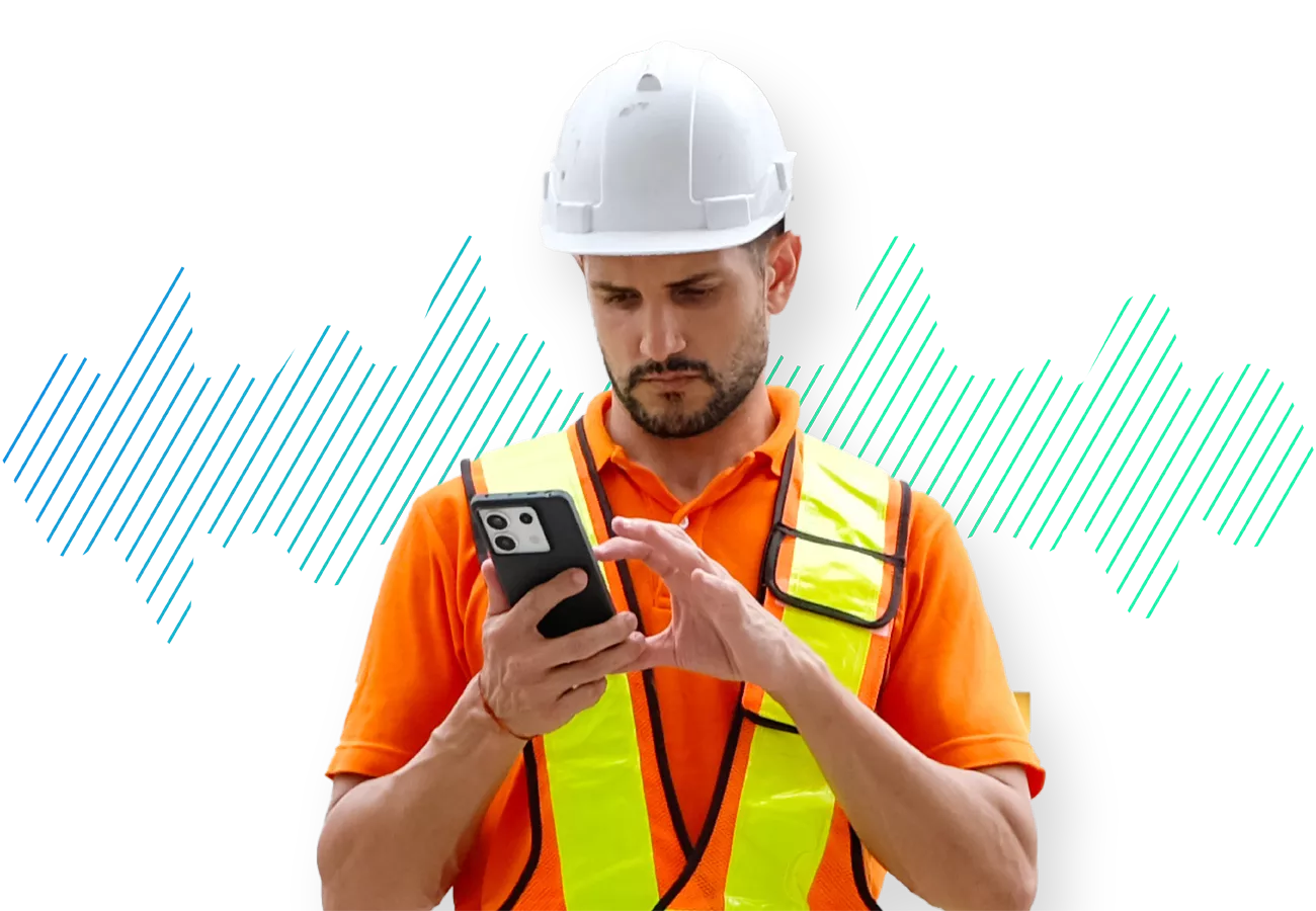 construction worker in vest on phone