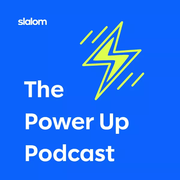 Square podcast cover art features the title 'The Power Up Podcast' in bold white text on a bright blue background. A stylized neon yellow lightning bolt icon appears prominently to the right of the text. The word 'slalom' is displayed in smaller white text at the top, indicating the podcast producer. The overall design is clean, modern, and energetic, emphasizing themes of power, energy, and inspiration.