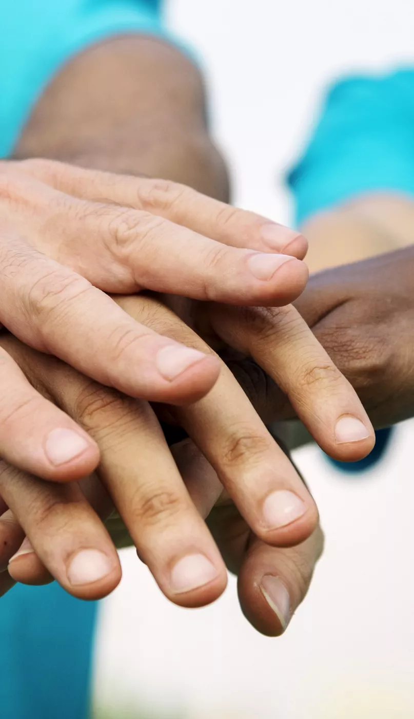 Photo of stacked hands