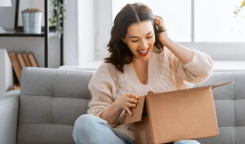 Woman opening box