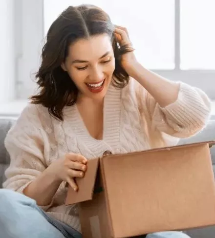 Woman opening box