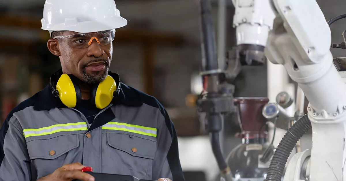 A man working on the lines and has headphones on. 