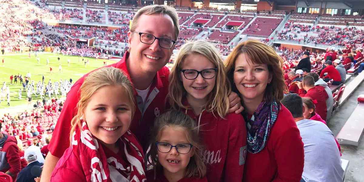 Slalom General Manager Lindsay Wenk and family in stadium at game.