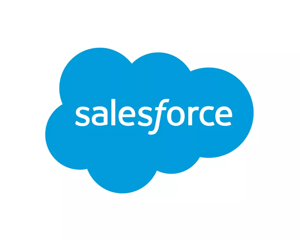 A bright blue cloud-shaped graphic features the word "salesforce" in white lowercase letters. The cloud has smooth rounded edges and sits centered on a plain white background. The design is simple and flat, emphasizing the text and the distinctive cloud silhouette. The overall look is clean, modern, and digitally oriented.