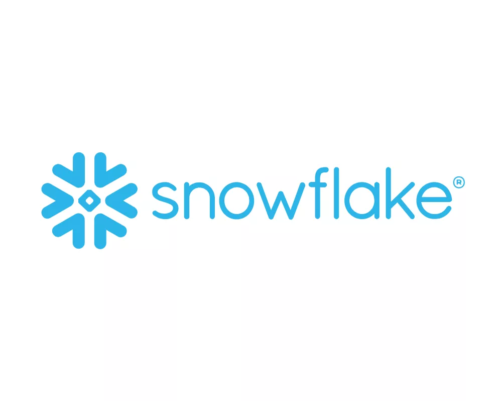 The image features the Snowflake wordmark in light blue lowercase letters. To the left of the text is a stylized blue snowflake icon composed of geometric shapes with a central diamond. A small registered trademark symbol appears to the upper right of the wordmark. The design is set against a clean white background, emphasizing the modern and minimal visual style.