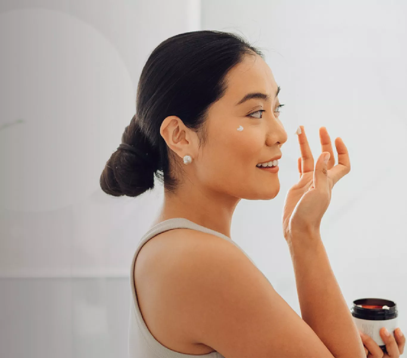 Woman putting on makeup