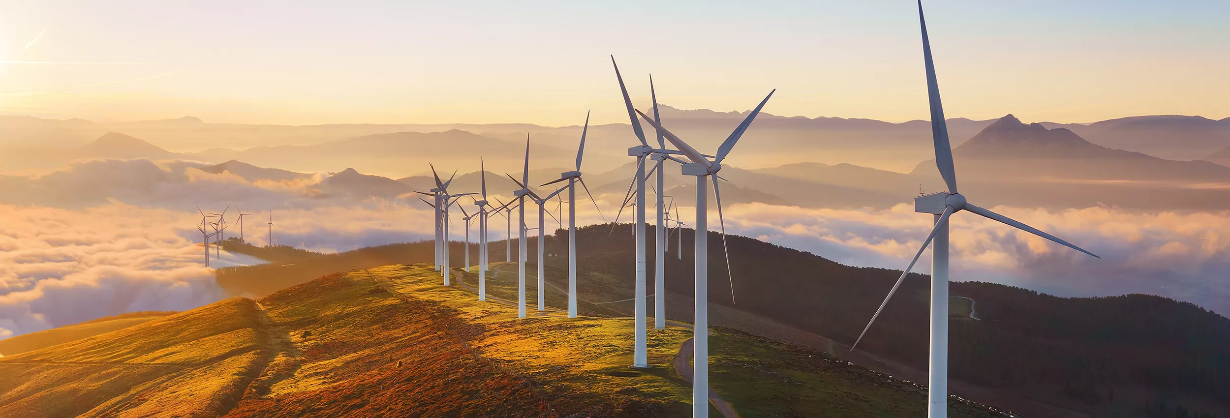 windmills on a cloudy mountain