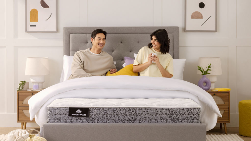 Couple on mattress with bed frame