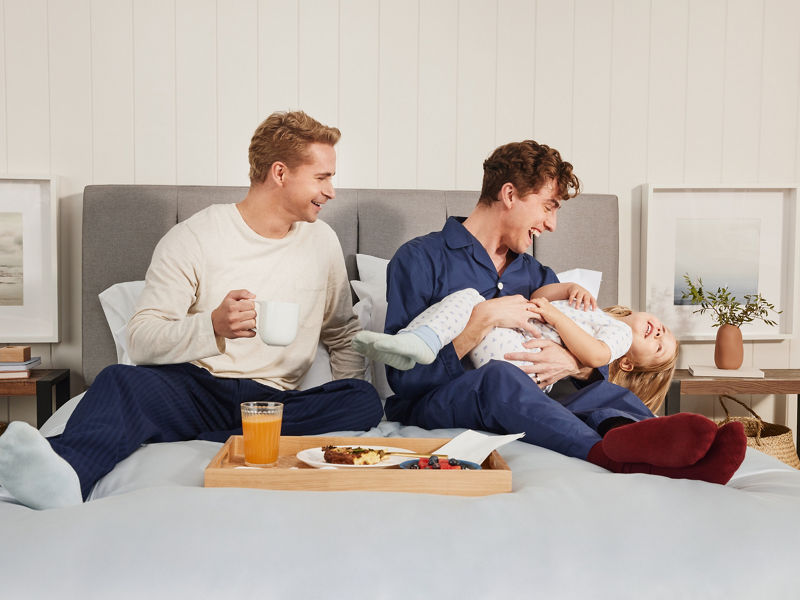 Couple on bed with child