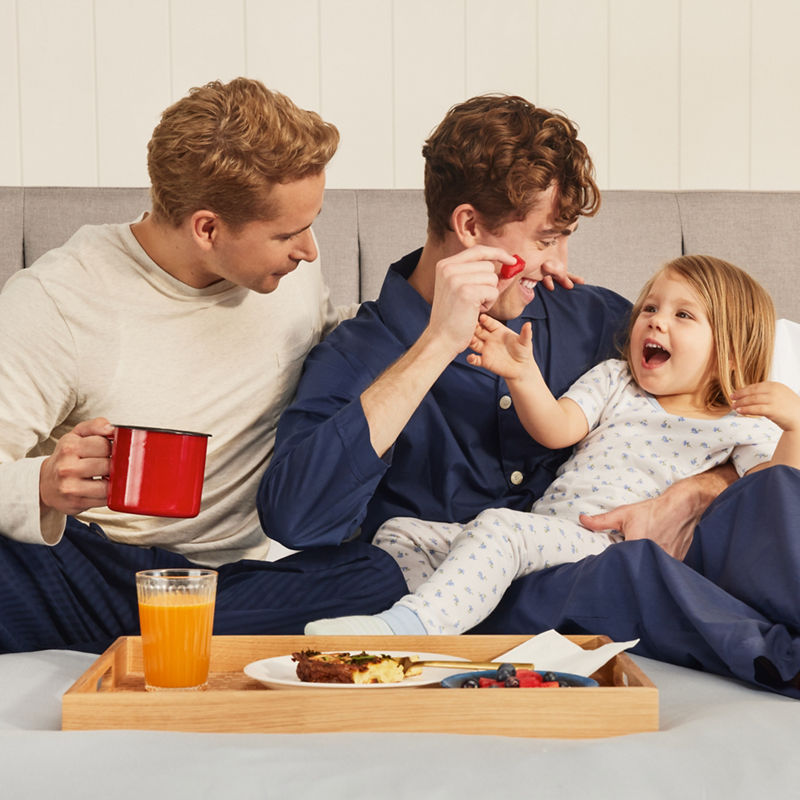 Couple laughing with small girl