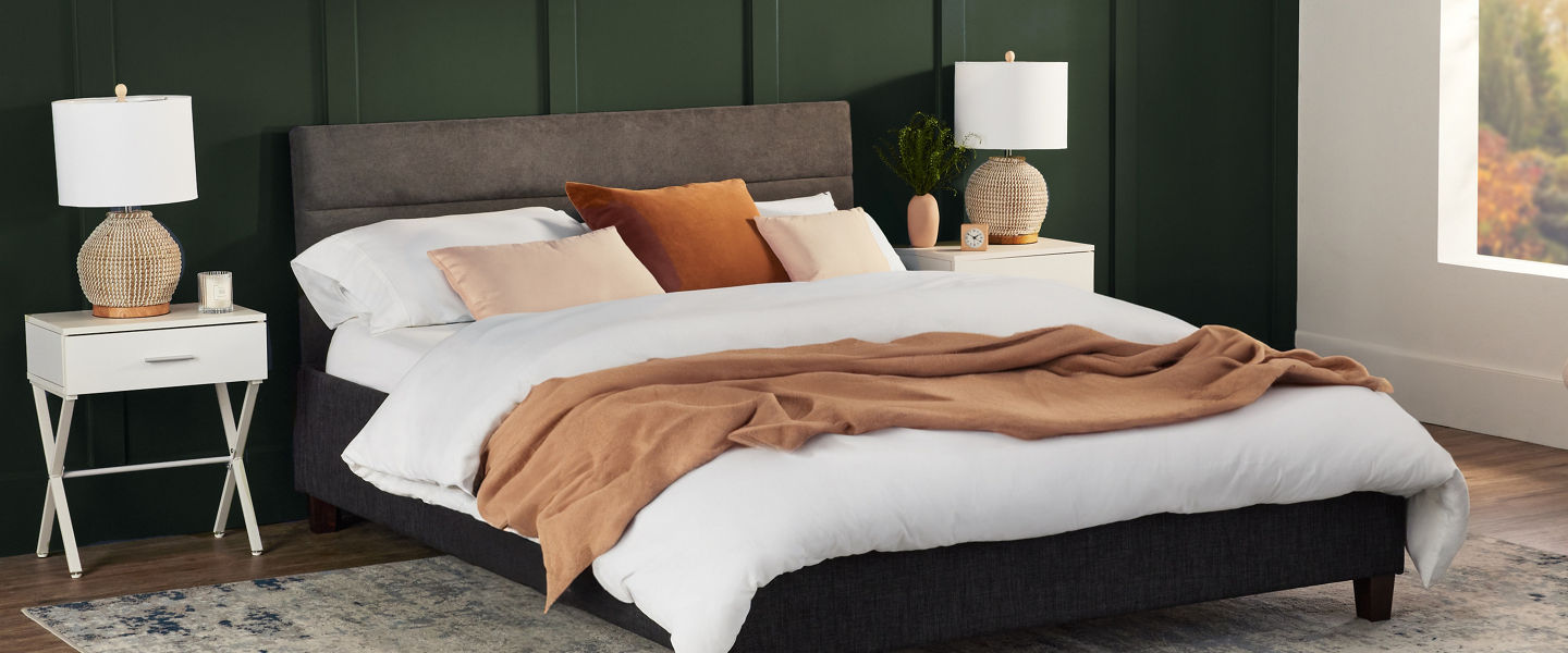 Young Boy on bed with headboard