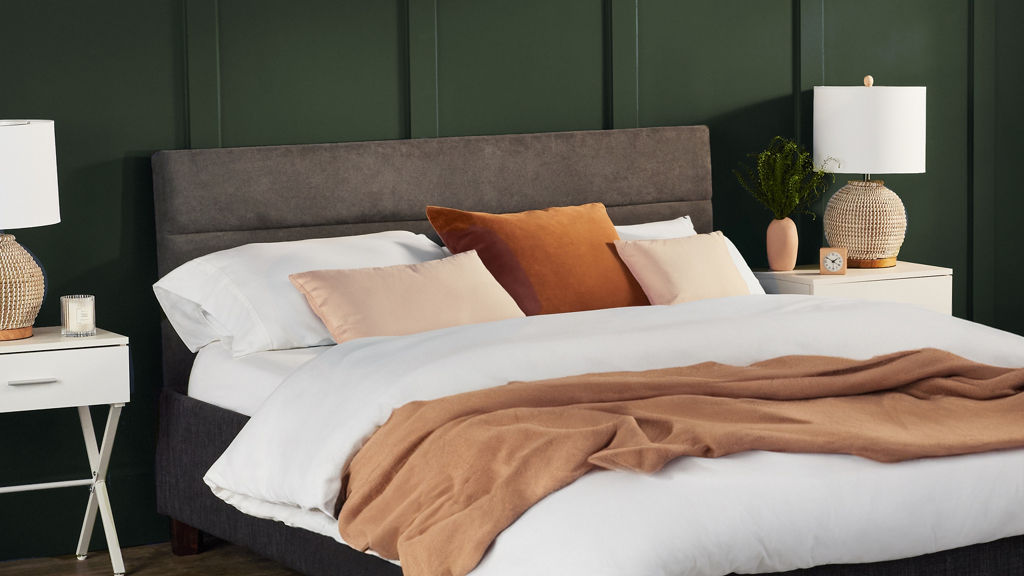 Young Boy on bed with headboard