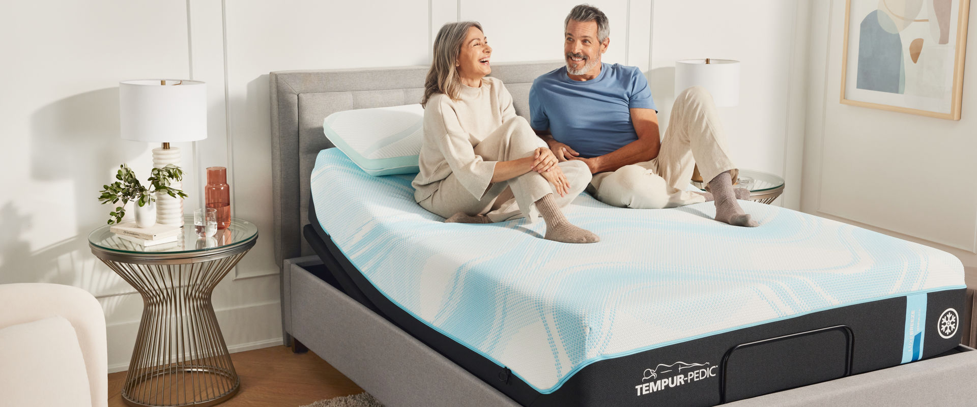 Couple laying on Tempur-Pedic Mattress