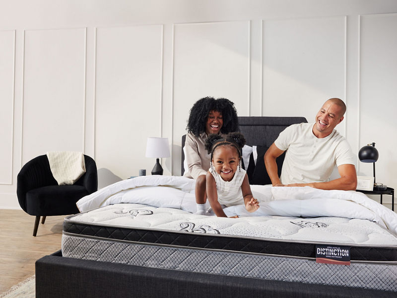 Famille sur un matelas Distinction