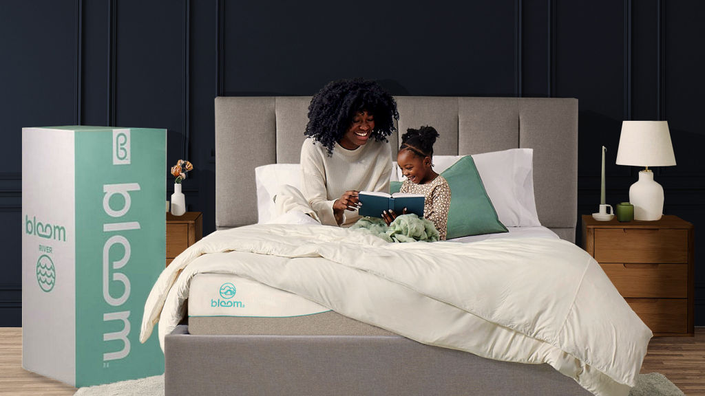 Mother Daughter sitting on Bloom Bed