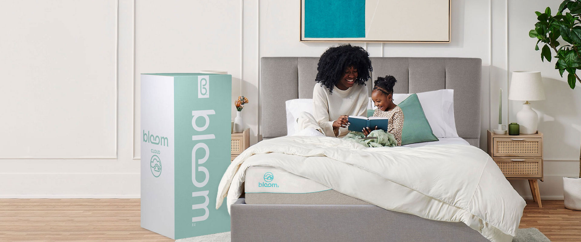 Mother Daughter sitting on Bloom Bed