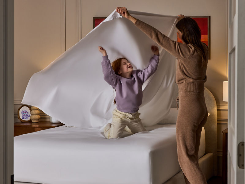 couple on bed with child