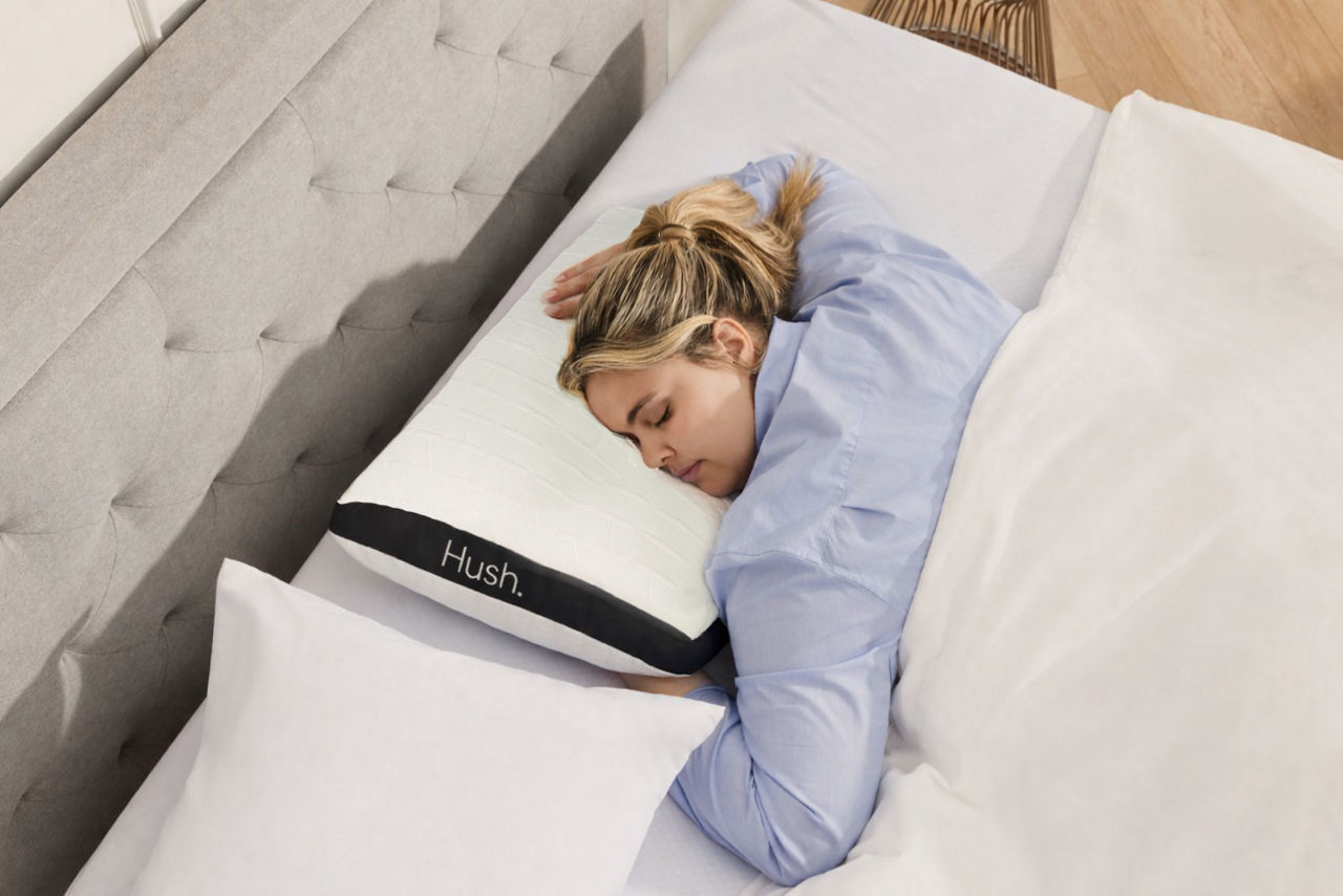 woman on stomach sleeper pillow