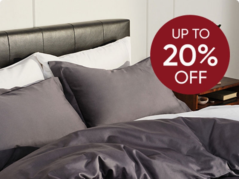 Couple with small child in bed