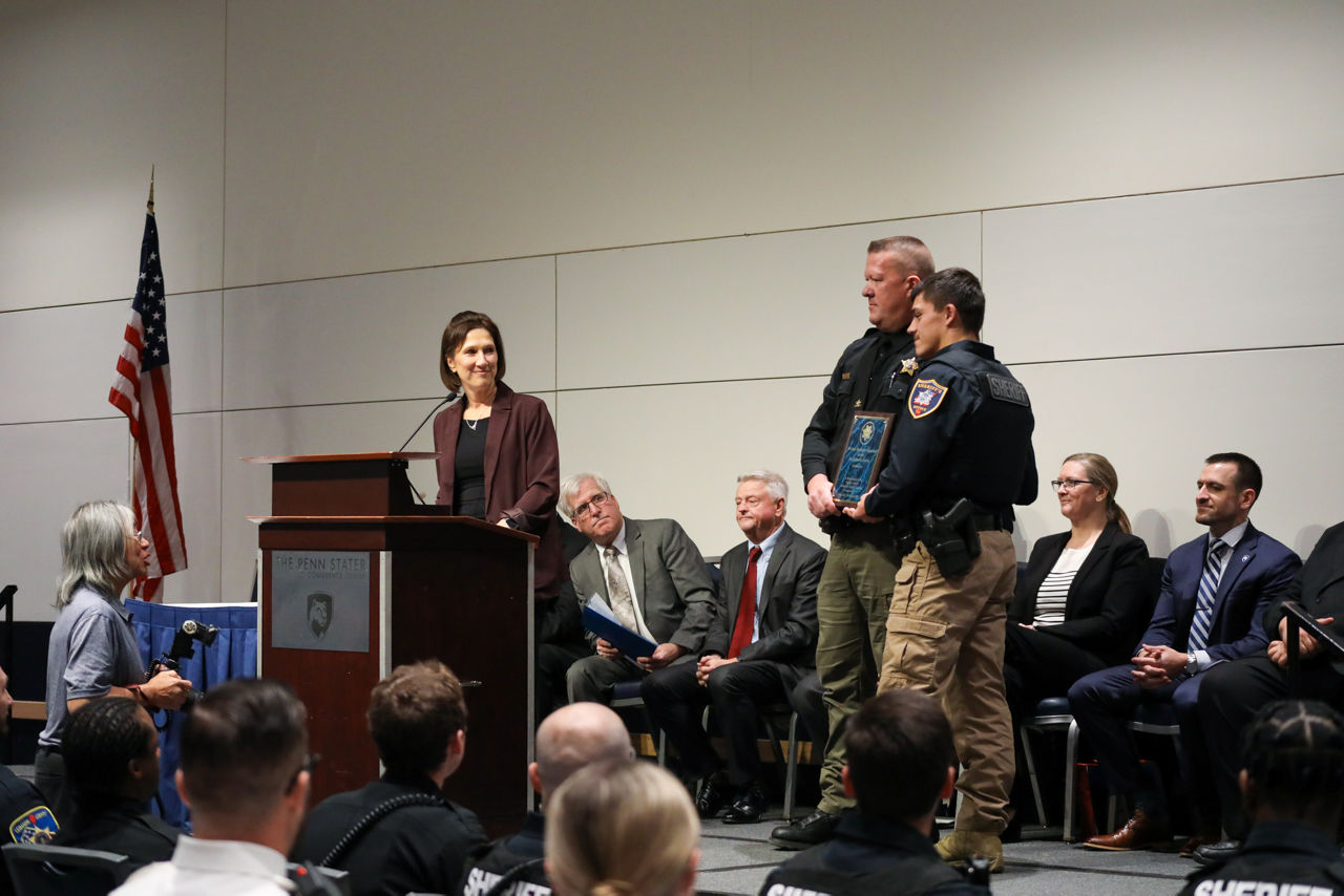 Bradford County Sheriff Clinton “CJ” Walters presents the Michael VanKuren Memorial Award to Somerset County Deputy Clayton Lee during the 72nd Sheriffs’ & Deputy Sheriffs’ Basic Training Academy Commencement Ceremony. Deputy Lee holds the plaque as Sheriff Walters stands beside him