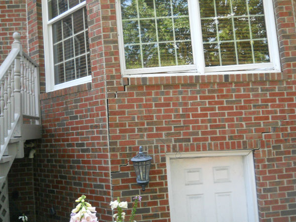 Brick cracking on side of house