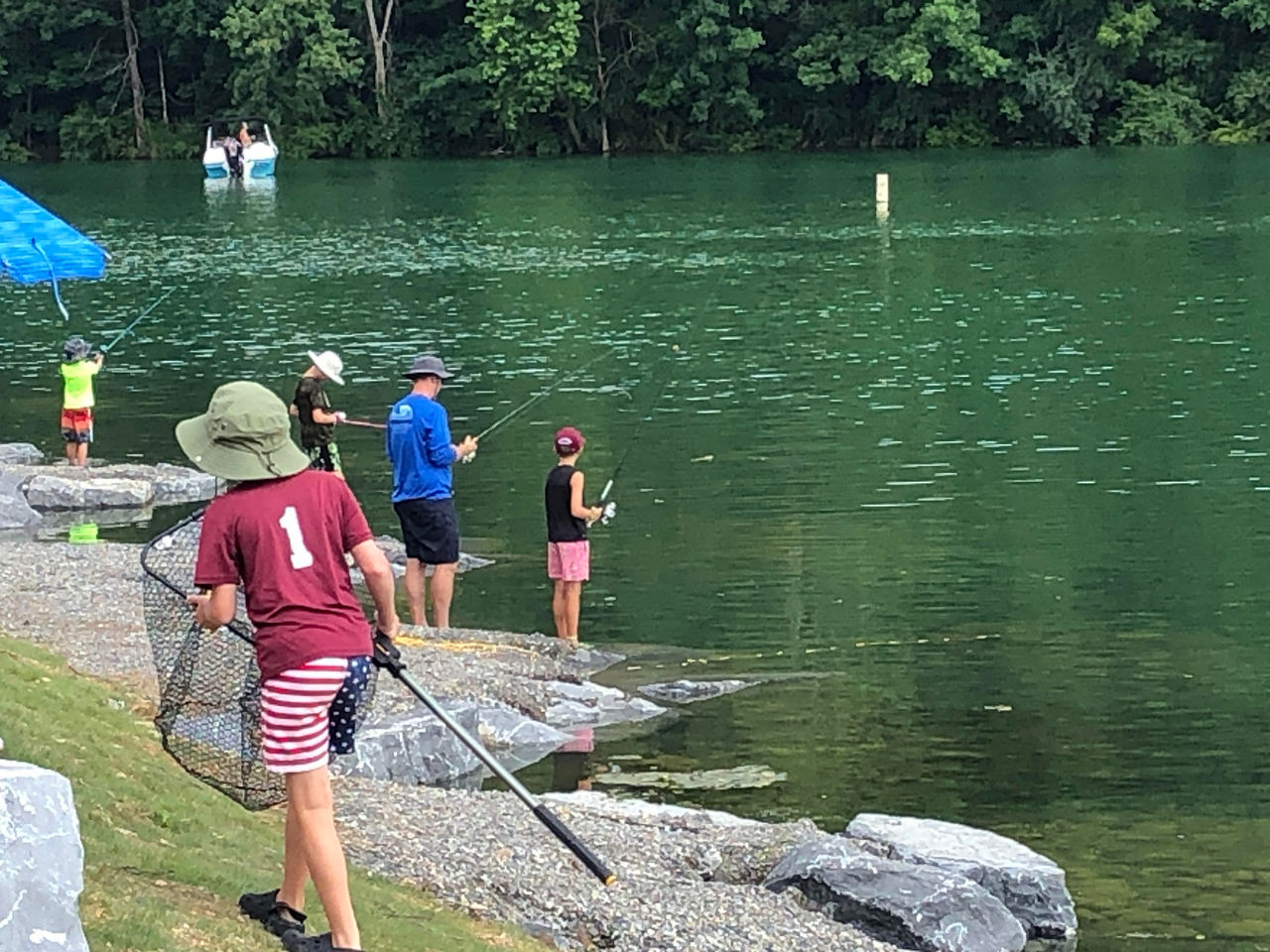 Anglers fishing along the newly stabilized shoreline made of rocks and large boulders along Hunters Run Cut Shoreline at Bald Eagle State Park.
