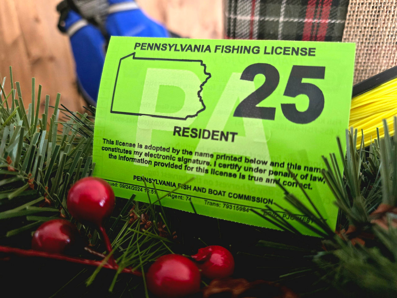 2025 Pennsylvania Fishing License on a Holiday Background