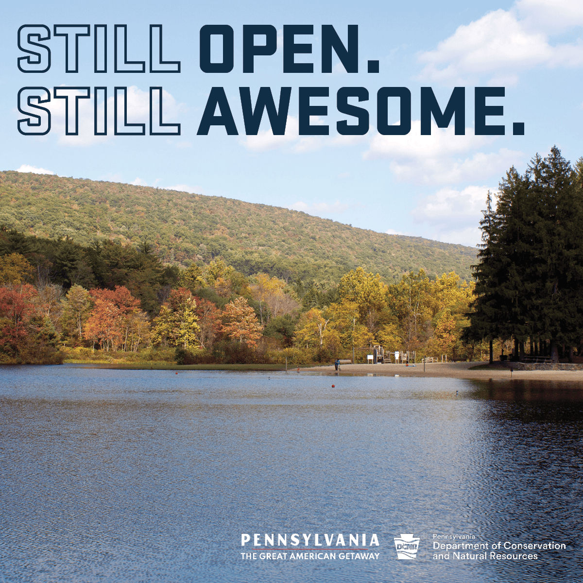 A scenic view of a calm lake surrounded by autumn foliage, with rolling hills in the background. The text overlay reads "STILL OPEN. STILL AWESOME." at the top, and "PENNSYLVANIA THE GREAT AMERICAN GETAWAY" at the bottom, along with the logo of the Pennsylvania Department of Conservation and Natural Resources.
