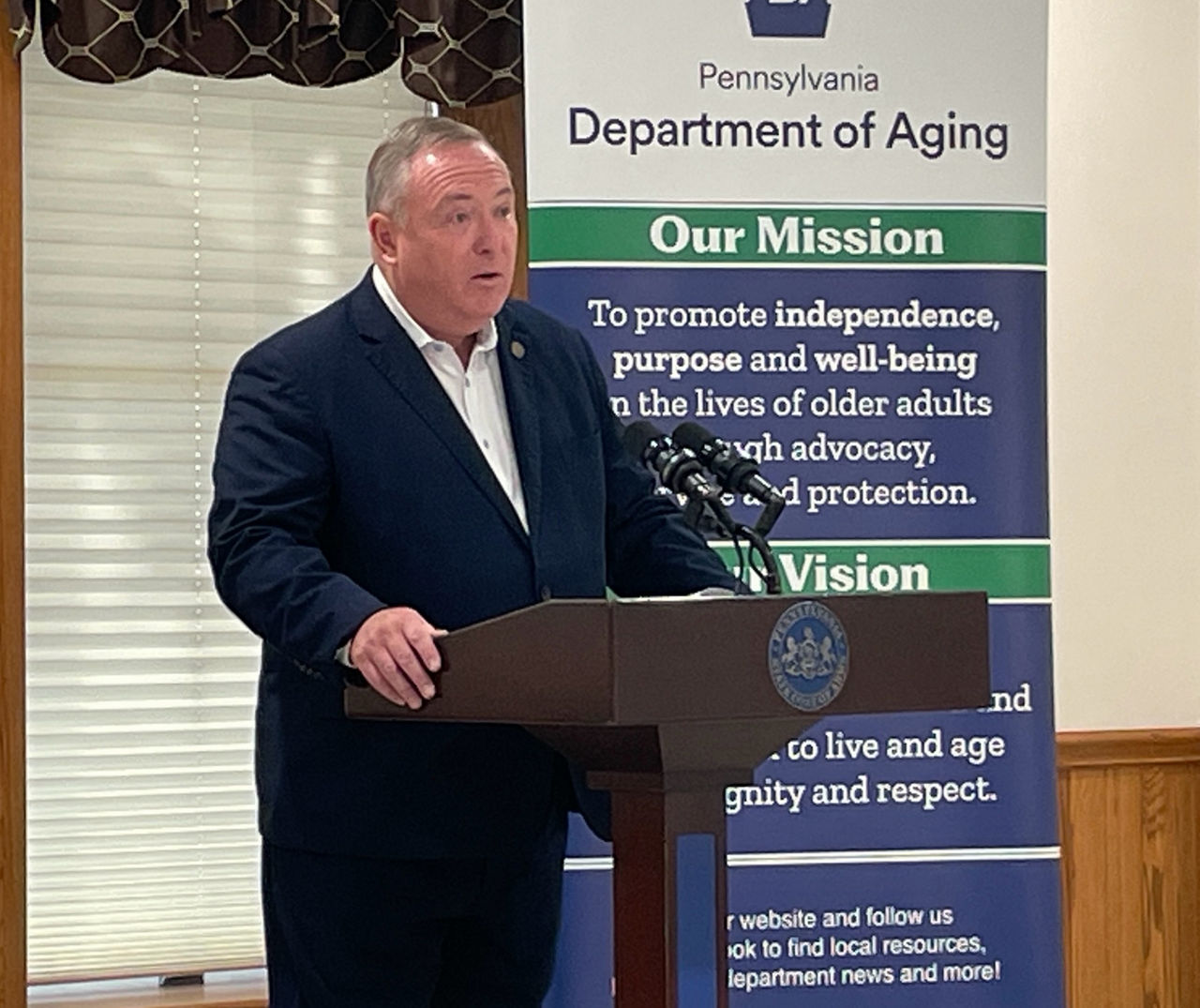 Sec. Kavulich speaks at podium at Crawford Co. CAPE Event
