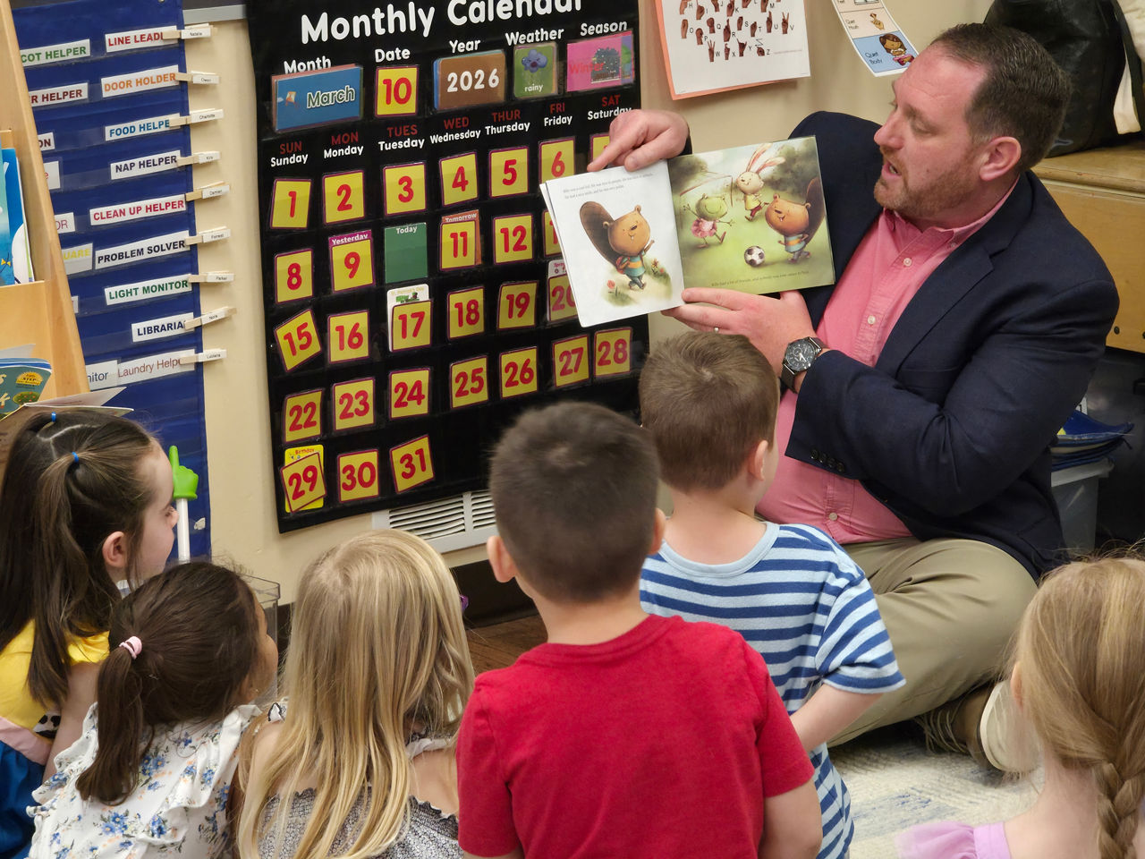 DHS Executive Deputy Secretary Andrew Barnes reads to children