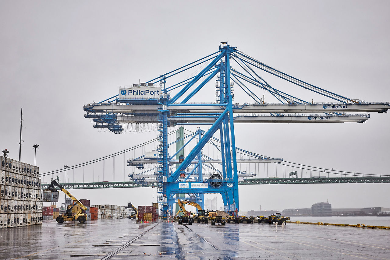 Cargo cranes on a dock at the Port of Philadelphia on a cloudy day
