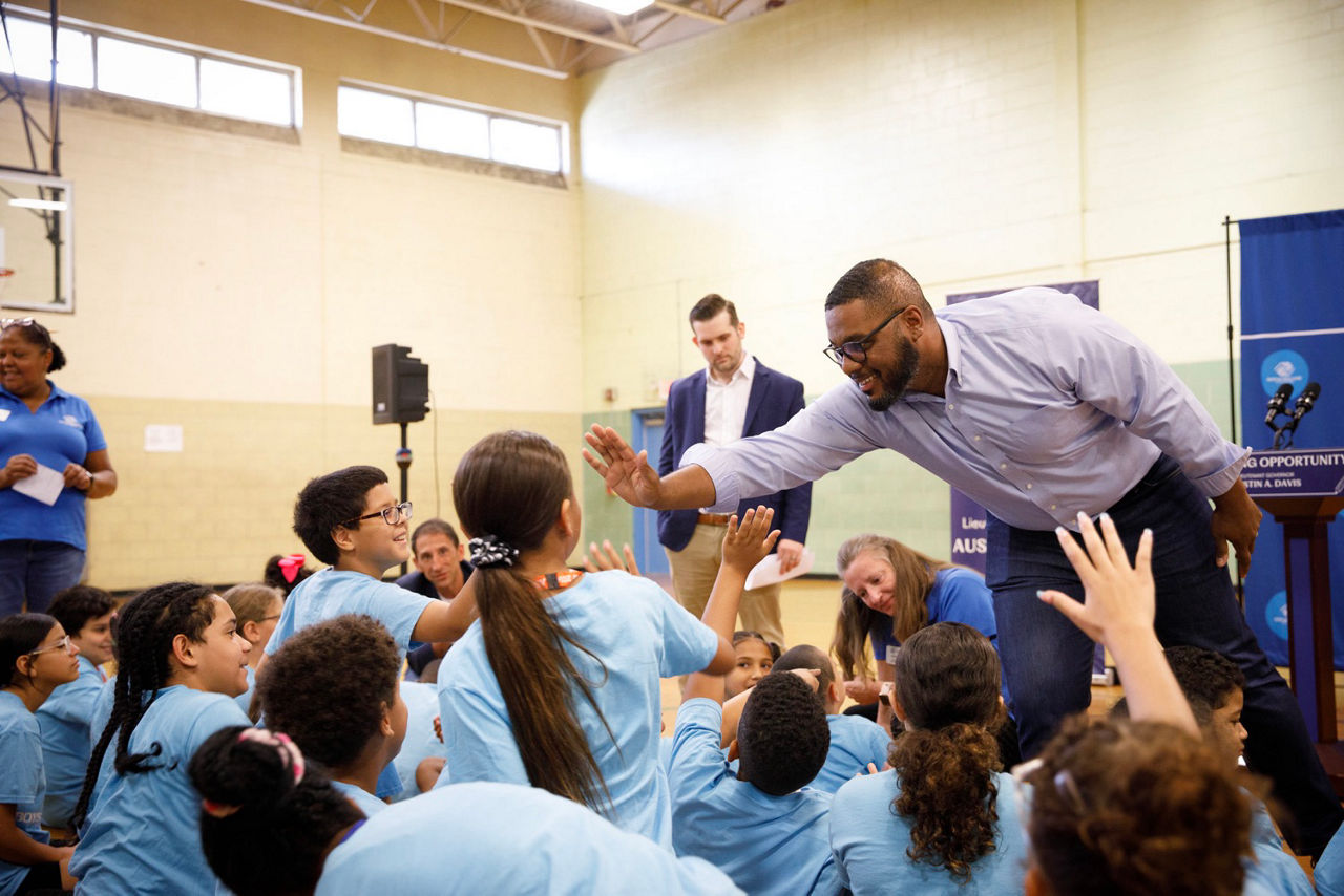 lAllentown, PA – Lt. Gov. Austin Davis grew up going to a Boys & Girls Club in his hometown of McKeesport, and today he visited the Boys & Girls Club of Allentown to celebrate a major victory in the bipartisan state budget — funding for afterschool programs that will help keep communities safe and give Pennsylvania kids more opportunities.  “The experiences I had at the Boys & Girls Club shaped me and helped put me on the path to becoming Lieutenant Governor,” said Lt. Gov. Davis, who leads the Pennsylvania Commission on Crime and Delinquency (PCCD). “That’s why we fought so hard to ensure the Shapiro-Davis budget included funding for afterschool programs, and we were incredibly proud to work with our partners in the legislature on both sides of the aisle, including Senator Lynda Schlegel Culver, Representative Mike Schlossberg and Representative Elizabeth Fiedler, to make this happen.”  Earlier this month Gov. Josh Shapiro signed the 2024-25 state budget, which:  Invests $11.5 million to create a statewide Building Opportunity through Out-of-School Time (BOOST) program through PCCD, which will aim to reduce community violence by providing more afterschool learning opportunities for young people; Invests $45 million in proven community-based programs to reduce violence through PCCD, including a $5 million increase for the successful Violence Intervention and Prevention (VIP) program, which supports a wide range of models focused on reducing community violence and relies on community groups that are most in tune with specific local needs; Includes a $5 million increase for the Nonprofit Security Grant Fund at PCCD, which provides resources for places of worship, community centers, and other entities to equip themselves with security measures; Increases funding for domestic violence services by an additional $2.5 million through the PA Department of Human Services (DHS). In April, the Lieutenant Governor joined Schlegel Culver in Milton to tout the BOOST proposal, as part of the Shapiro-Davis budget to support kids and families and reduce violence.  “The BOOST program will offer students valuable opportunities to connect with peers, receive additional homework support and develop new skills,” said state Sen. Nick Miller. “By providing structured afterschool care, we are proactively working to prevent violence in our communities and ensure the safety of our residents. These students represent the future leaders of Pennsylvania, and I am proud to support this initiative to broaden their horizons.”  "For the past four years, myself, the Lieutenant Governor, Senator Lynda Schlegel Culver and Representative Fiedler have worked with a series of partners to make BOOST a reality,” said state Rep. Mike Schlossberg. “Today, we celebrate government at its best: Investing in our kids to promote educational opportunities, keep our children safe and help parents stay in the job market. This is a huge win for kids, profits and the world-class organizations that do this work."  "Out-of-school time programs like BOOST can be life-changing,” said state Rep. Elizabeth Fiedler. “They keep young people safe even after they leave school, while allowing their parents to maintain jobs. Until now, inadequate funding has meant thousands of students left on waiting lists and their families left in the lurch. This year's investment in afterschool and violence prevention programs will change that. It's a major win for children, families and Pennsylvania's economy."  Earlier this year Davis received the Boys & Girls Clubs of America’s State Alliance Champion Award, as well as the Pennsylvania Alliance of YMCAs’ YMCA Champion Award, for his support for afterschool programs.