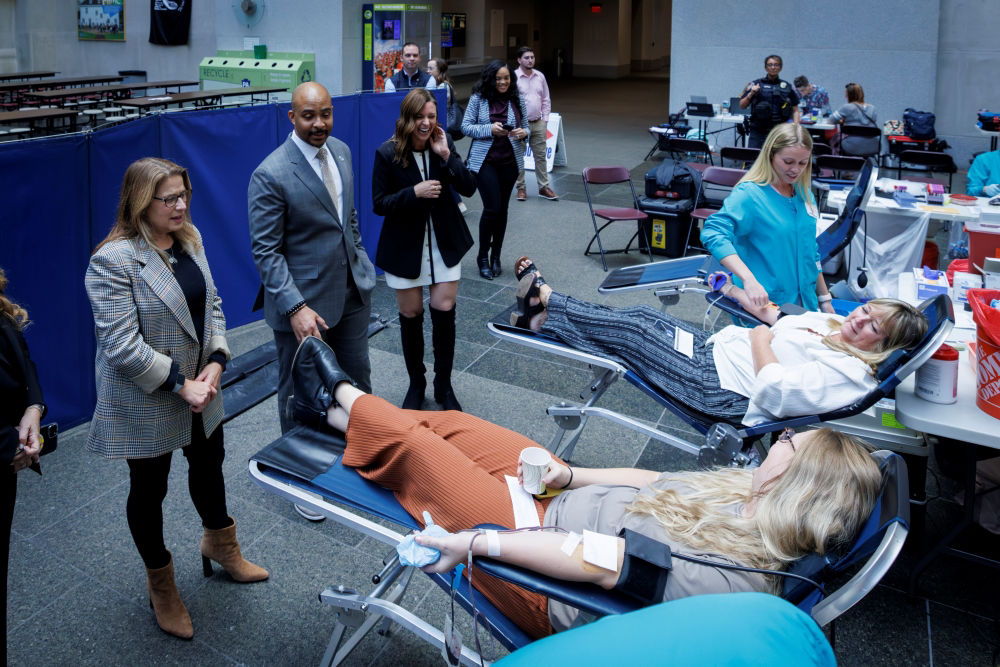 First Lady Lori Shapiro and Commonwealth officials speak to employees while they are giving blood.