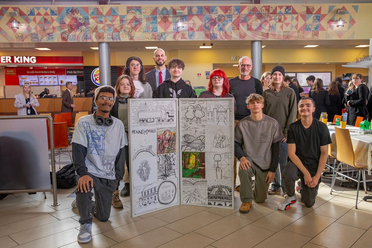 Denver, PA.  Art students from Cocalico HS pose in front of the mural after Wednesday's event.  The Pennsylvania Council on the Arts (PCA) and Pennsylvania Turnpike Commission (PA Turnpike) unveiled a new mural at the Bowmansville Service Plaza on the PA Turnpike – with artwork created by Cocalico High School art students. This is the sixteenth piece created in conjunction with Art Sparks, a PCA and PA Turnpike partnership to bring student-created, locally relevant artwork to service plazas across the PA Turnpike’s 565-mile system. December 4, 2024.