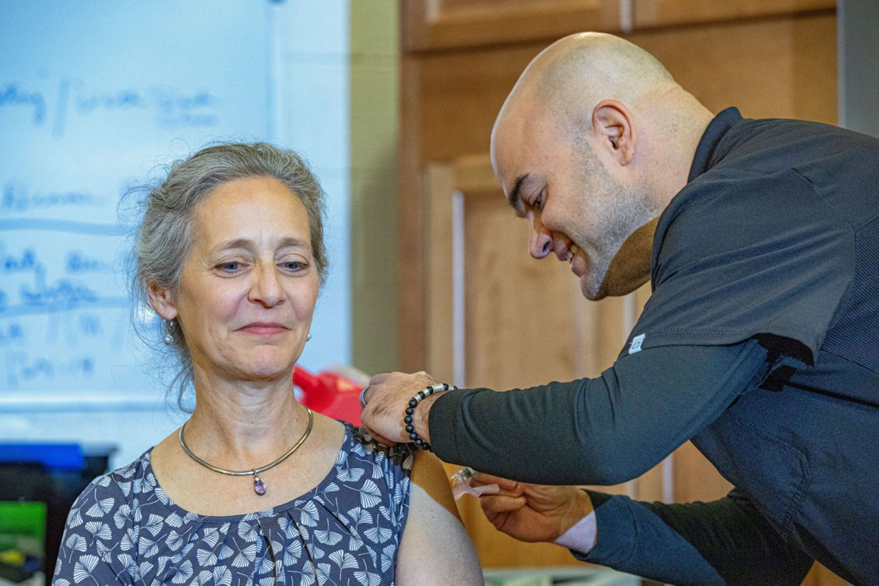 woman receiving flu vaccine