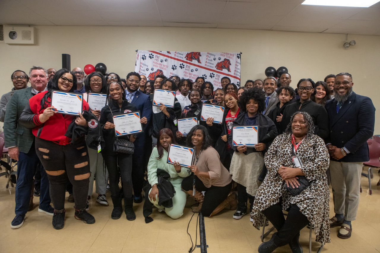 Group of students hold their Early Childhood Education Pre-Apprenticeship program certificates