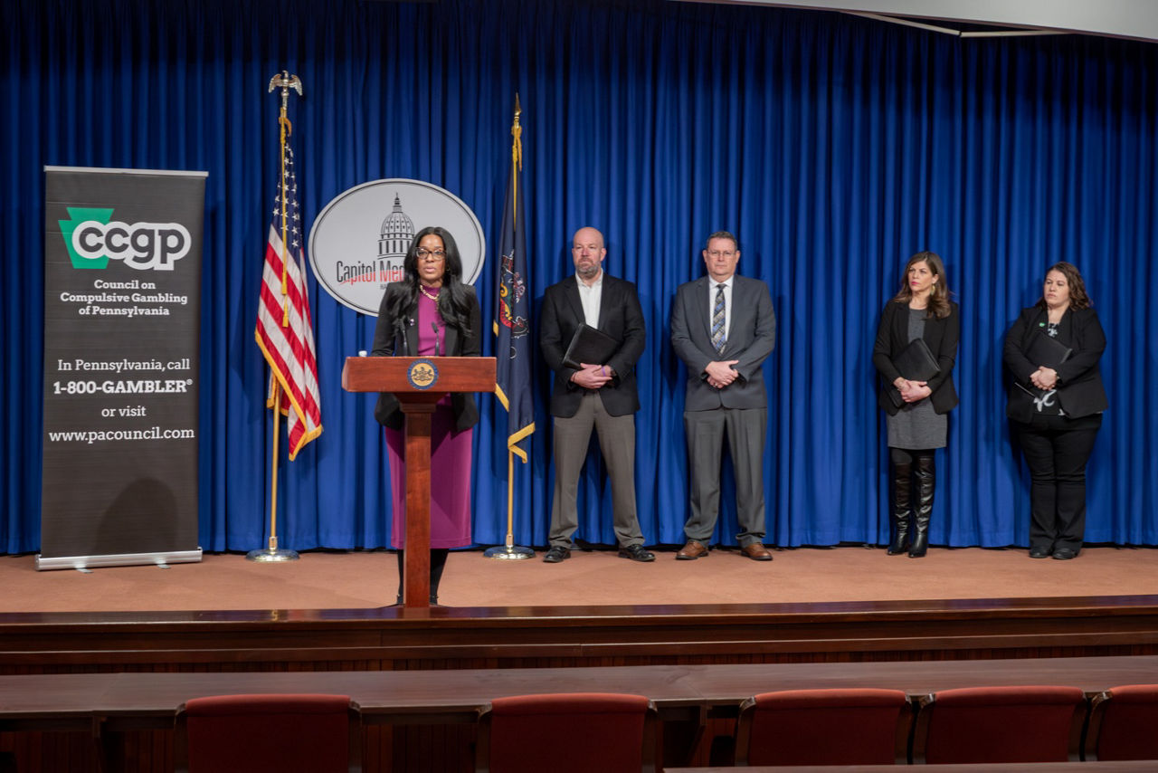 DDAP Secretary at podium for Problem Gambling Awareness Month Press Conference