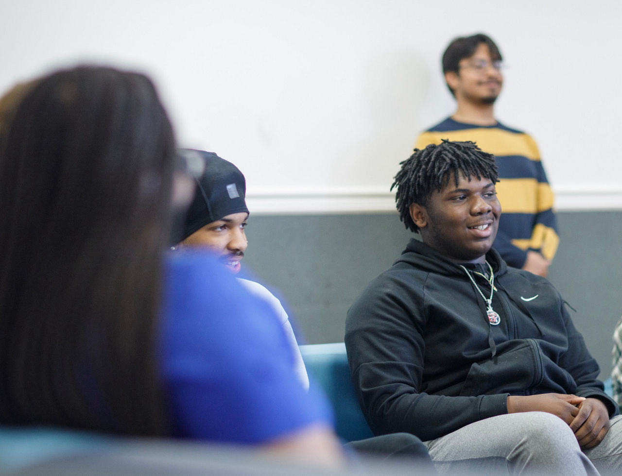 teen boy student sitting and listening