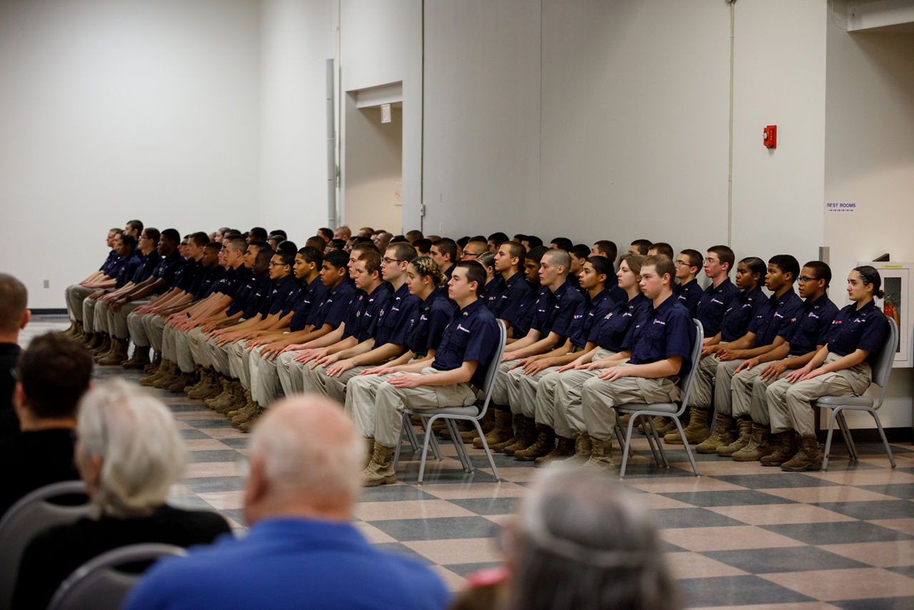 Keystone Challenge Academy Cadets Kneeling in front of the academy logo.
