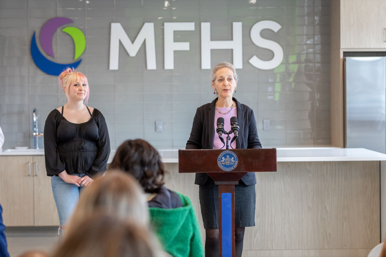 Picture of Secretary of Health Dr. Debra Bogen speaking at the podium