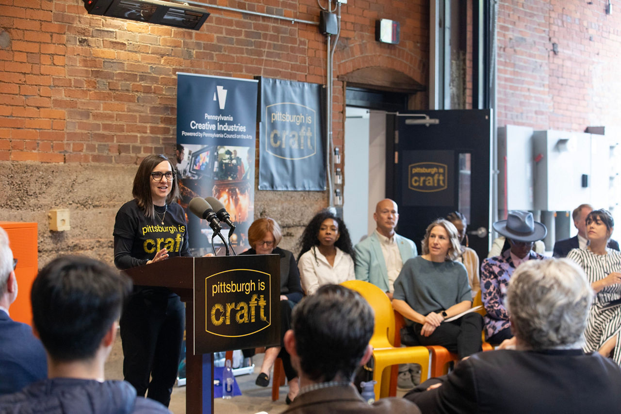 Rachel Rearick, Contemporary Craft Executive Director, joins Pennsylvania Council on the Arts at the Contemporary Craft Blacksmithing Studio to announce critical seed funding to launch a national, multi-year initiative, Pittsburgh IS Craft.

Pennsylvania Creative Industries, powered by Pennsylvania Council on the Arts (PCA), announced $87,000 in seed funding to launch Pittsburgh IS Craft — a first-of-its kind, multi-year initiative with national reach aimed at positioning Pittsburgh as a premier destination for craft in the United States. 
 
Pittsburgh IS Craft is a collaborative initiative led by the Pittsburgh Glass Center (PGC), Contemporary Craft, and Union Project — three well-established Pittsburgh-based organizations offering world-class facilities, exhibitions, and programming across fiber, wood, metal, ceramics, and glass media. The initiative will help drive tourism to the Pittsburgh region for people to see, make, and buy craft through collaborative marketing efforts, elevate Pittsburgh artists in markets across the country, and build meaningful partnerships that ultimately contribute to the local economy.

"We are excited to announce this partnership and expand our collaborative work,” said Contemporary Craft Executive Director Rachel Rearick. “The wonderful thing about Pittsburgh IS Craft is that it's been here all along—our city fabricated the steel and glass that built the world. Now, we're innovating with these same materials to cultivate a creative economy rich in craft culture. We appreciate PA Creative Industries for recognizing and supporting this work.”