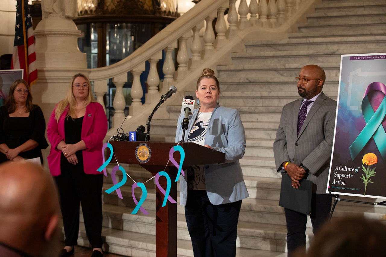 Department of Corrections Secretary Dr. Laurel Harry at the podium