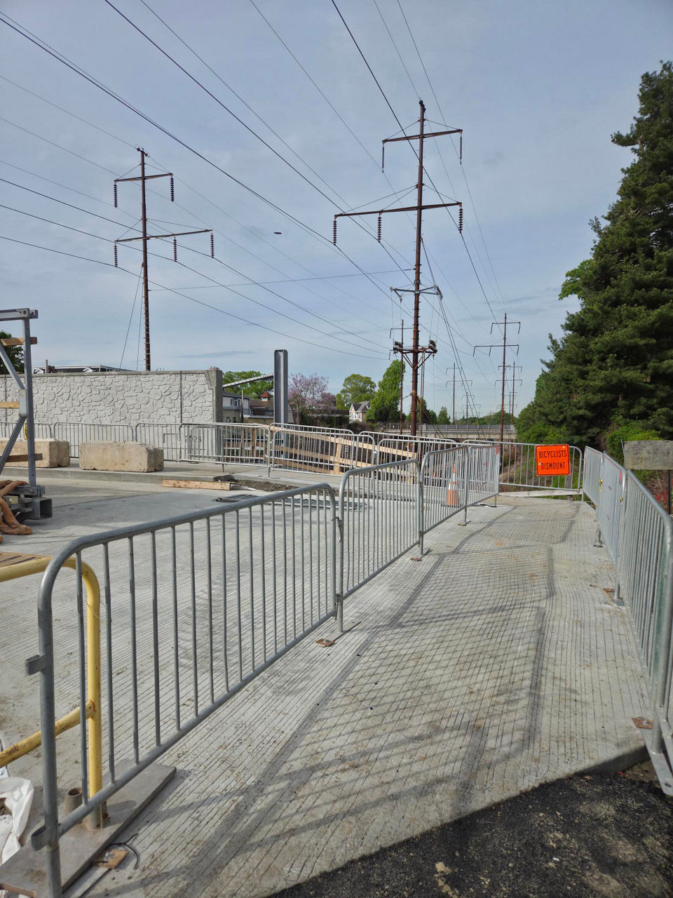 Curving view of new sidewalk along Sellers Avenue Bridge
