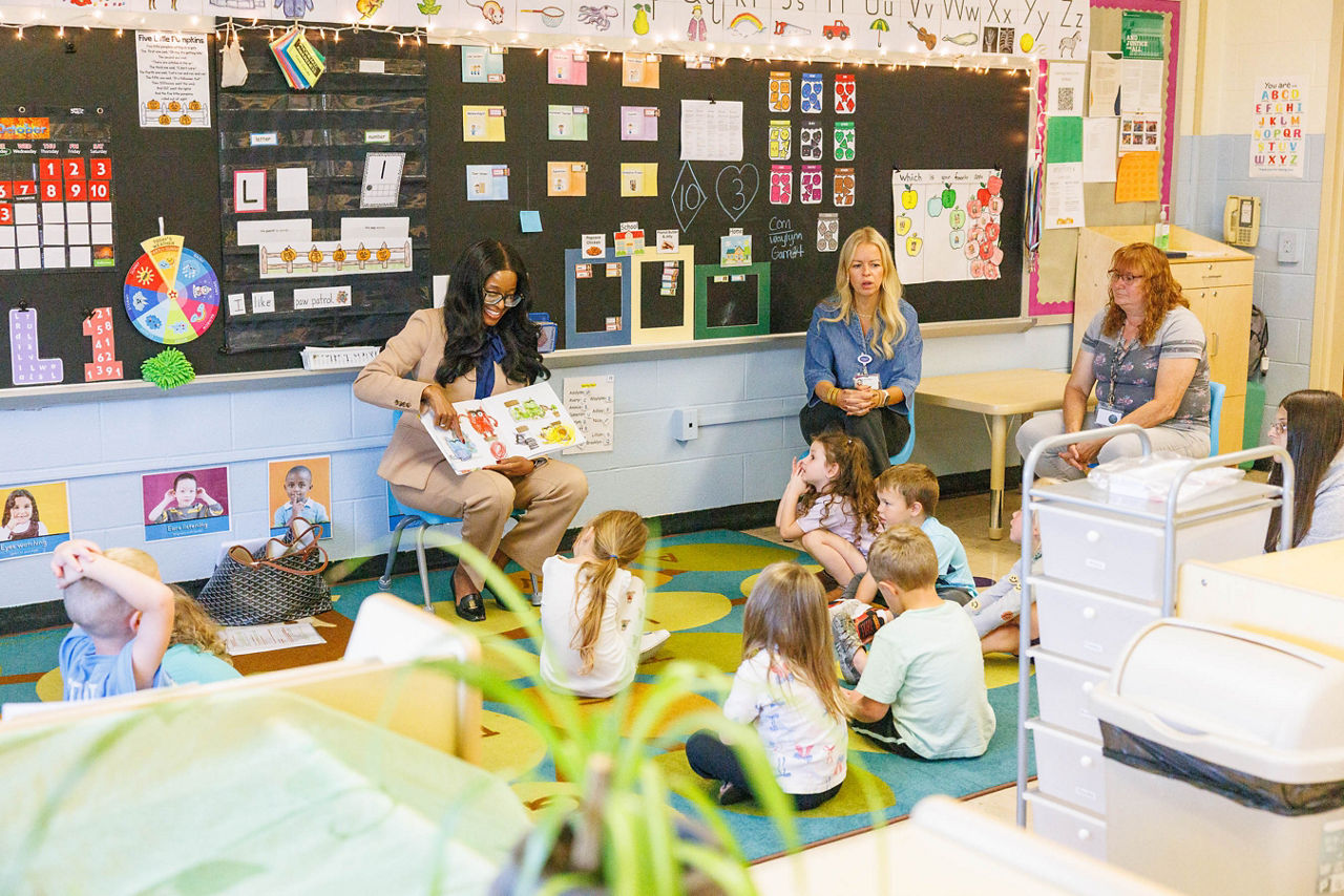 Secretary Latika Davis-Jones reads a story to pre-k students while visiting a Healthy Alternatives for Little Ones (HALO) pre-K program