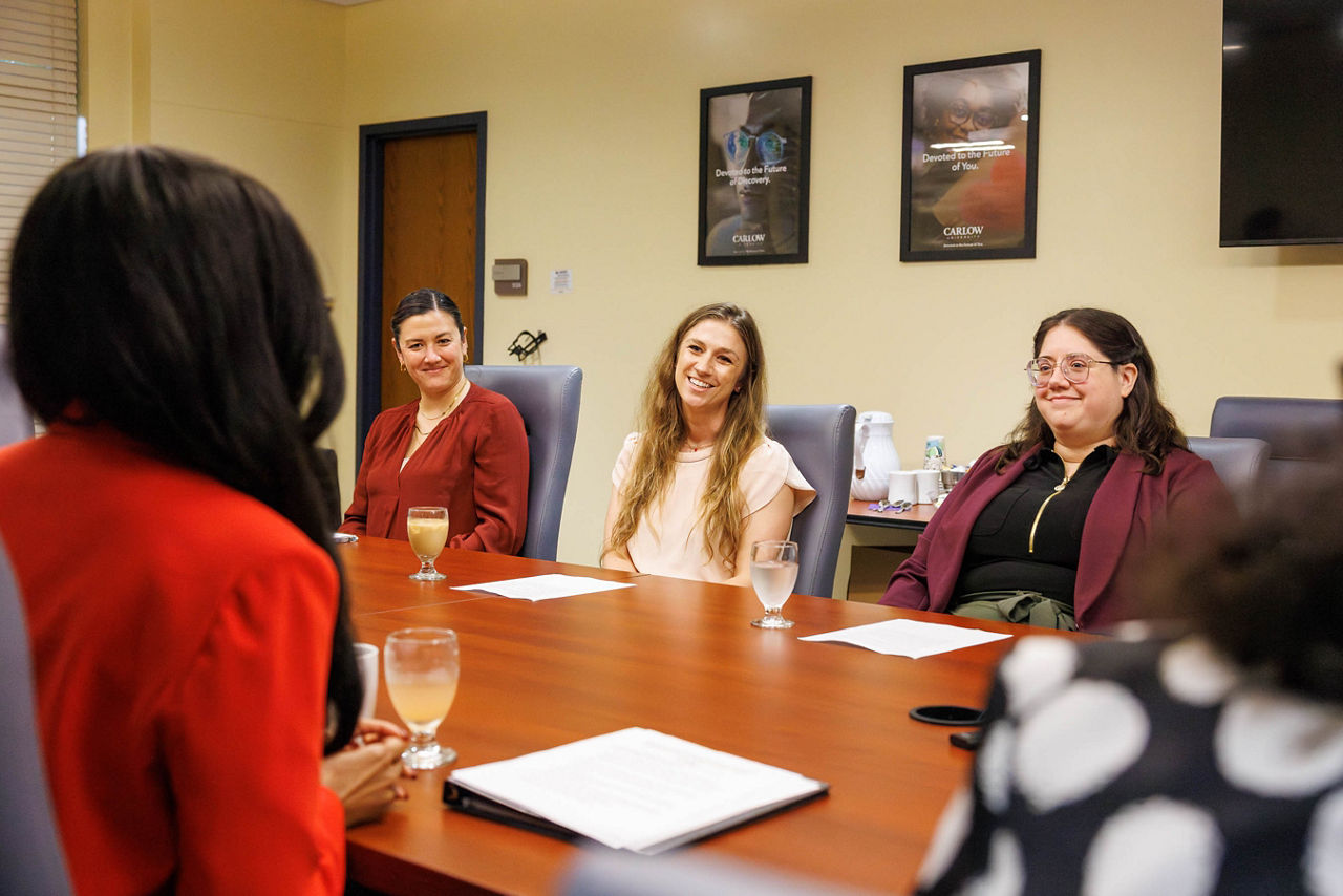 Carlow University alumna Abbey Sandberg, JADE Wellness Center Supervisor Leanna Watt, and Carlow University student Karyssa Blair sit at a table in discussion with Pennsylvania Department of Drug and Alcohol Programs Secretary Dr. Latika Davis-Jones about the Addiction Counseling Workforce Impact Project.